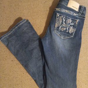 Grace in LA Jean's with pink and blue pocket embellishments